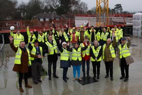 Woodlands Meed students, staff and governors with West Sussex County Councillors and ISG staff at the 'topping out' ceremony on February 22