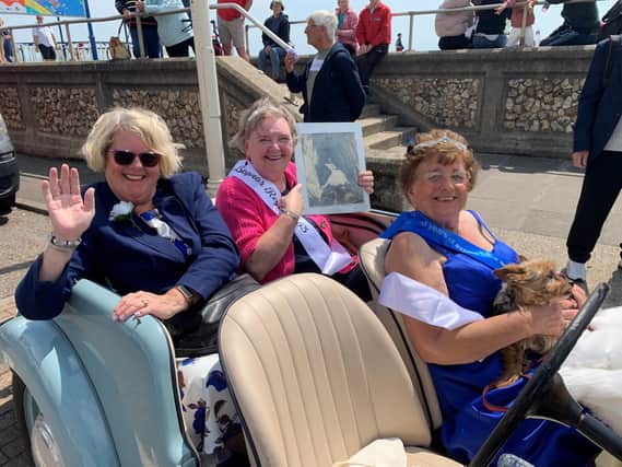 Bognor's Queen for a day, Pam Evans, gives a royal wave