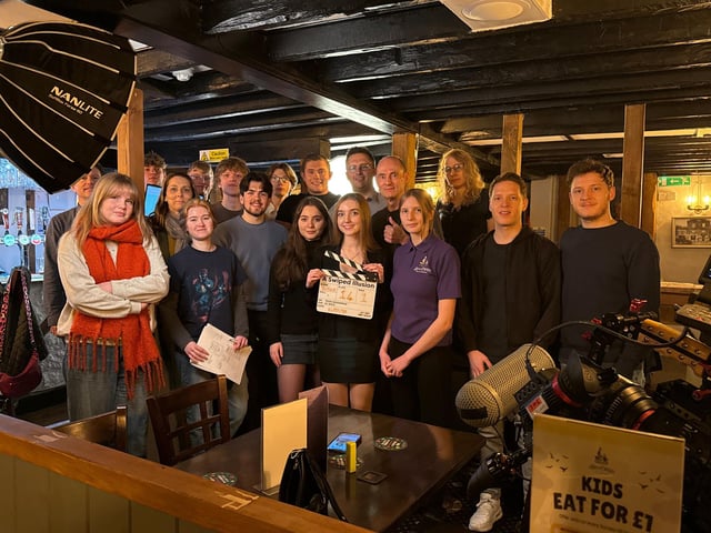 Some of the cast and crew of 'A Swiped Illusion' on set at the Hen and Chicken, Southwater