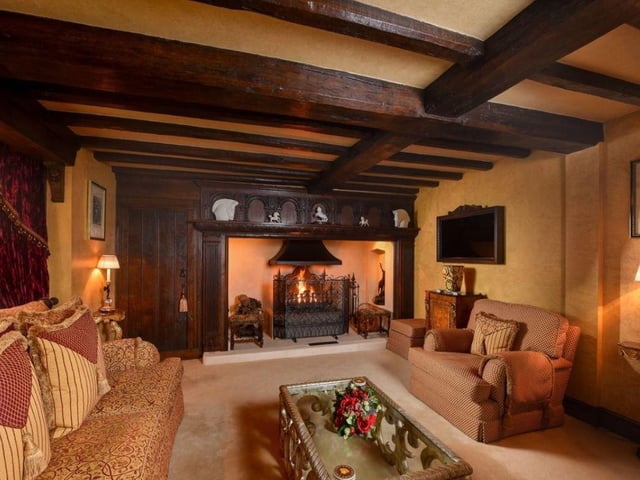 A family room/snug includes a wine cellar