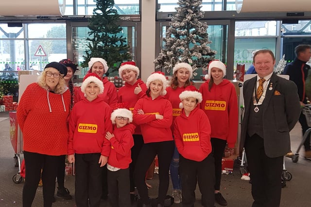Pat Fisher, pictured far left, with children from the charity Gizmo raising money at the St Leonards Asda in 2018. Picture: Pat Fisher