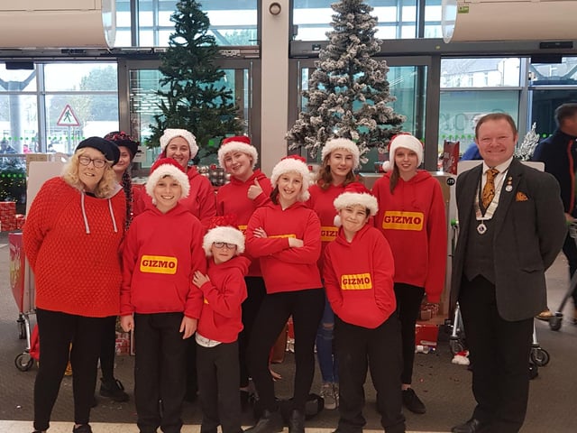 Pat Fisher, pictured far left, with children from the charity Gizmo raising money at the St Leonards Asda in 2018. Picture: Pat Fisher