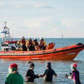 Littlehampton RNLI lifeboat crews look on as people took part in the December Dip last year. Picture: RNLI