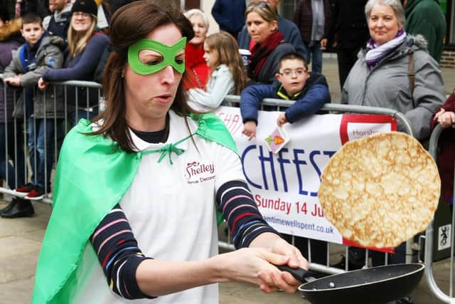 One of the contestants in Horsham pancake races in 2019. Photo by Derek Martin Photography.