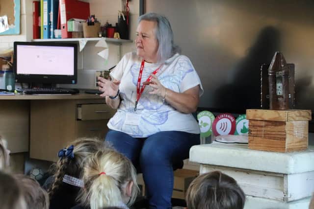 Beekeeper Michelle Ernoult talks to pre-prep children at Highfield and Brookham