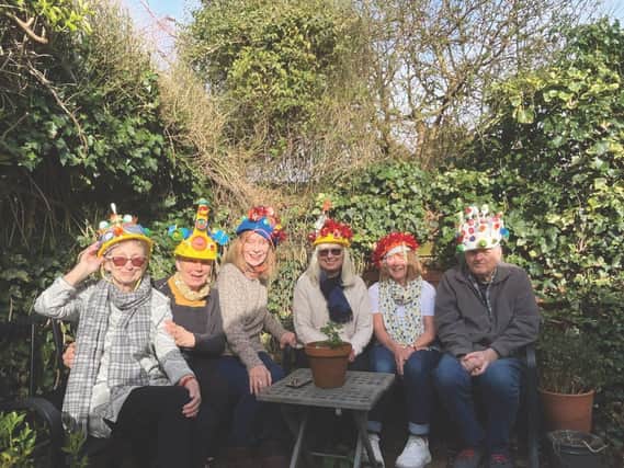 Crowned with repurposed plastic site helmets are, left to right, Sue Casebourne, Sally-Mae Joseph, Geraldine Edmonds, Sarah Gregson, Andrea Hargreaves and Nigel Goss