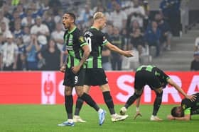 Brighton's Brazilian striker Joao Pedro (L) celebrates after scoring a penalty during the UEFA Europa League Group B first leg football match at Olympique de Marseille