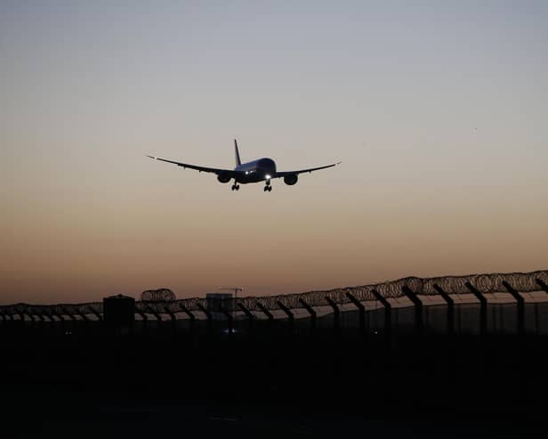 A plane arrives at Heathrow Airport. (Photo by Hollie Adams/Getty Images)