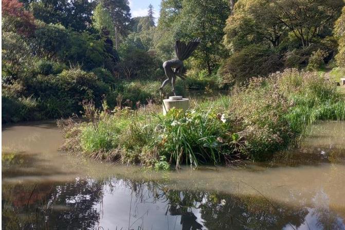 A sculpture on Engine Pond at Leonardslee Lakes and Gardens