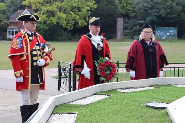 Cllr James Bacon has laid a wreath on behalf of local people at the town's war memorial in Alexandra Park.