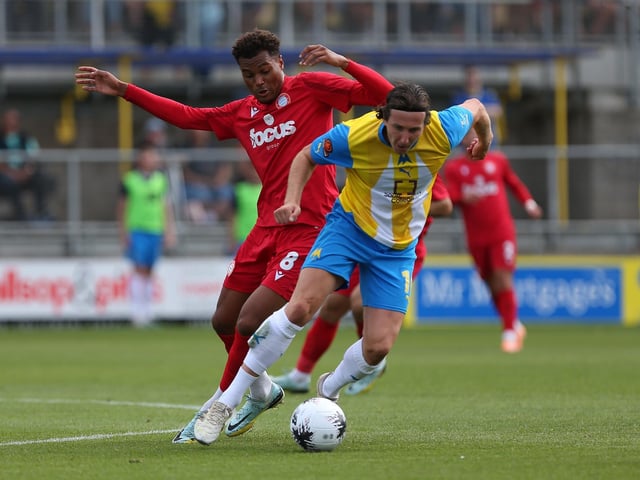 Action from Worthing's 3-0 win at Torquay United which put them top of National League South
