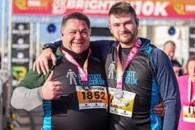 Damon Knee with his son Aaron after completing the Brighton 10k event. 
