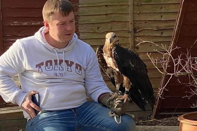 Luke Lloyd with a Huxley's white bellied eagle
