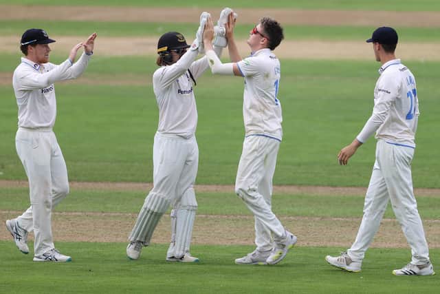 Jack Carson (2r) of Sussex is congratulated by wicketkeeper Oli Carter after bowling Chris Cooke of Glamorgan during day one of  the LV= Insurance County Championship Division 2 match between Glamorgan and Sussex at Sophia Gardens (Photo by Michael Steele/Getty Images)