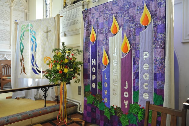 To celebrate the Queen's Jubilee a Flower and Quilt show in St Mary's Church with flower arrangements by Worthing Flower Club and quilted banners by Chris Diebel. Pic S Robards SR2206021
