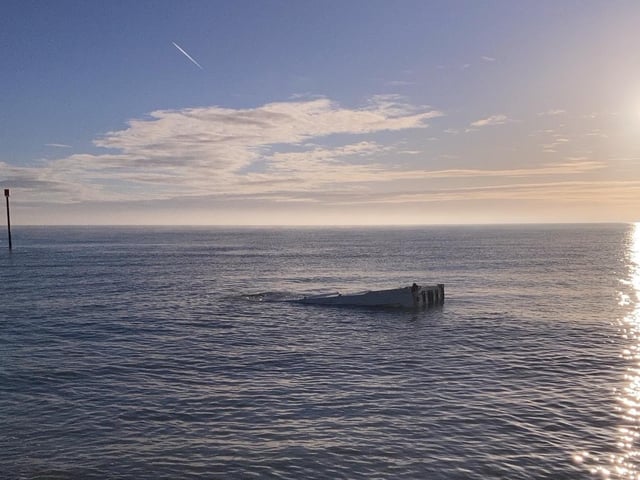 Wealden District Council issued a warning to residents after a shipping container washes ashore in Pevensey Bay.