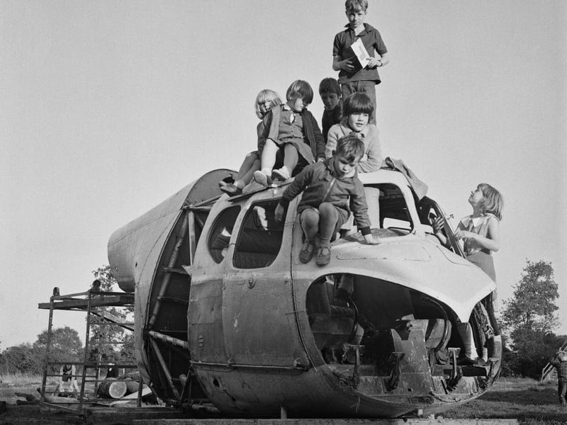 Children playing in an aircraft cockpit in Crawley New Town playground on 19th September 1966.
