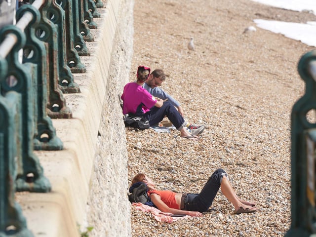 Residents soak up sun on Sussex beach ahead of Storm Lillian