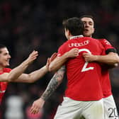 Marcel Sabitzer, Victor Lindelof and Diogo Dalot of Manchester United celebrate after the team's victory in the penalty shoot out during the Emirates FA Cup Semi Final match between Brighton & Hove Albion and Manchester United. (Photo by Mike Hewitt/Getty Images)