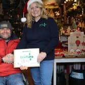 Christmas tree farmer Clive Collins with Bexhill Foodbank representative Jenni Barnes