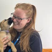 Behaviour and welfare adviser Sarah Carden with a nine-week-old puppy