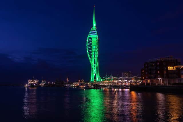 The Spinnaker Tower lights turn green for International Phelan-McDermid Syndrome Awareness Day. Picture: Mike Cooter (221022)