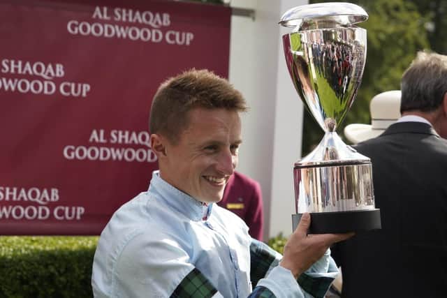 Tom Marquand with the Goodwood Cup after his stunning victory on Quickthorn | Picture: Clive Bennett