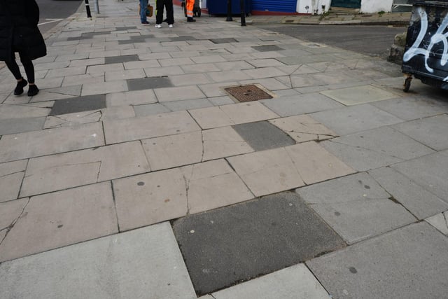 Photo showing the state of the pavement in Hastings town centre. 31/1/24. The area by St Mary in the Castle.