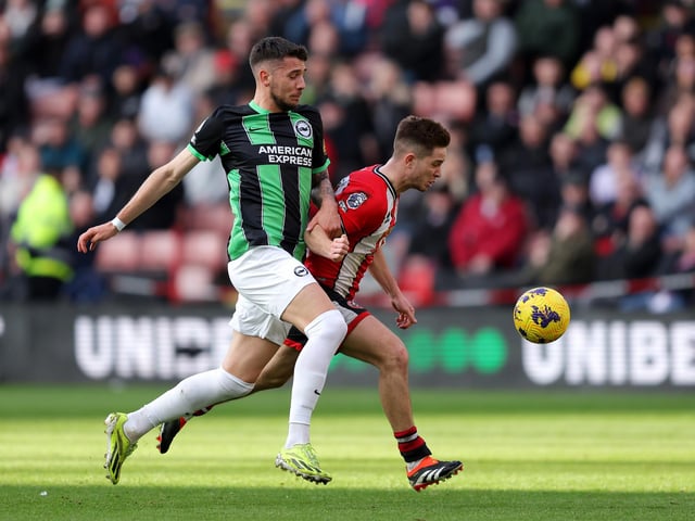 SHEFFIELD, ENGLAND - FEBRUARY 18: Jakub Moder of Brighton & Hove Albion battles for possession with shu2during the Premier League match between Sheffield United and Brighton & Hove Albion at Bramall Lane on February 18, 2024 in Sheffield, England. (Photo by Matt McNulty/Getty Images)