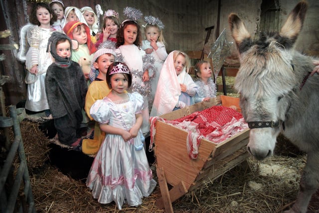 HOR 141207 Fisher's Farm, Wisborough Green, nativity with Climbing Bears pre-school and real donkey -photo by steve cobb