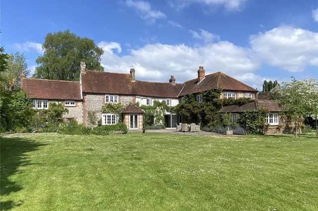 A delightful, wisteria clad period house occupying a lovely south facing plot stretching to almost three quarters of an acre.