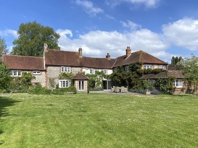 A delightful, wisteria clad period house occupying a lovely south facing plot stretching to almost three quarters of an acre.