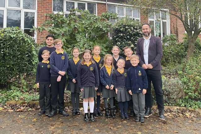 Herstmonceux CofE School celebrate good Ofsted rating - Head of School Stuart Ritchie with students (photo from school)