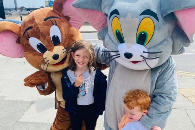 Tom and Jerry pose with children in Hastings Old Town