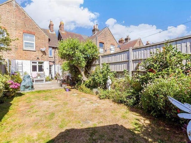 The garden is very pretty, with a lawn and borders