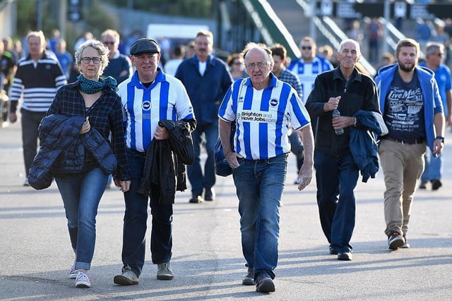 Brighton & Hove Albion supporters make their way to the stadium prior to the Sky Bet Championship match between Brighton & Hove Albion and Rotherham United at Amex Stadium on August 16, 2016.