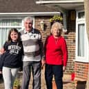 Jackie Harris with her husband and granddaughter after the recent thefts from her garden