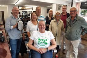 Marianne Wright with barber Peter Jones after her Brave the Shave, supported by husband Richard Wright, friends and neighbours