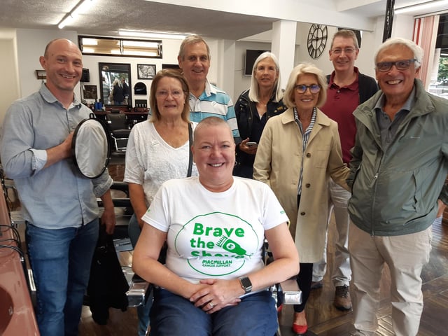 Marianne Wright with barber Peter Jones after her Brave the Shave, supported by husband Richard Wright, friends and neighbours