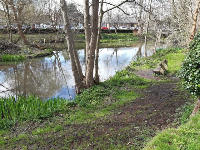 Follow the path round with the lake on your left