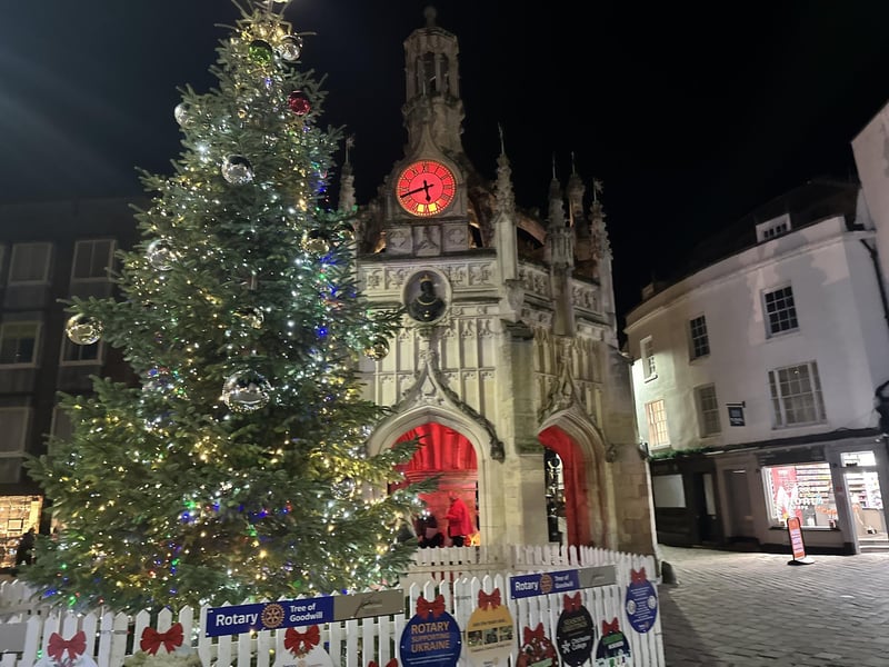 The Rotary Tree of Goodwill, framed by the city cross, is a symbol of Christmas in the city.