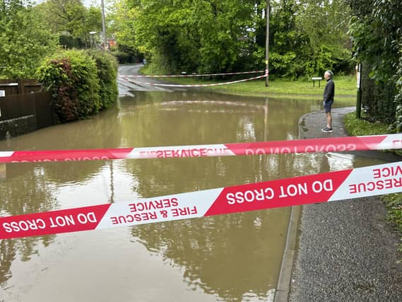 In Pictures: West Sussex road closed following heavy flooding