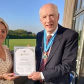 ​​Worthing Town Football Club volunteer Pauline Fox being presented with her Coronation Champion award by the High Sheriff of West Sussex, Andy Bliss