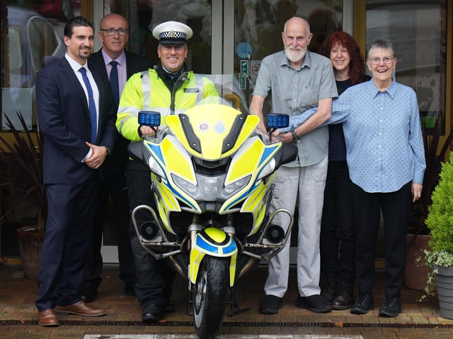Sussex Police Federation equality and wellbeing lead, Andy Newman, (second, left) arranged the visit after being contacted by Alan's daughter, Amanda (second, right). PC Dan Pattenden (centre) agreed to bring one of his road policing bikes.