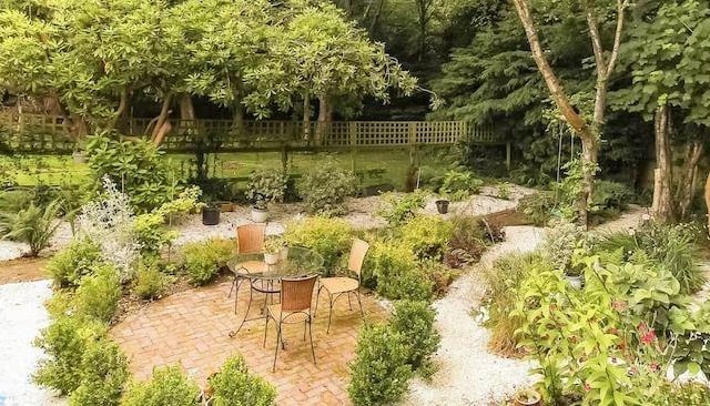 There is a lovely seating area amid the well-stocked garden