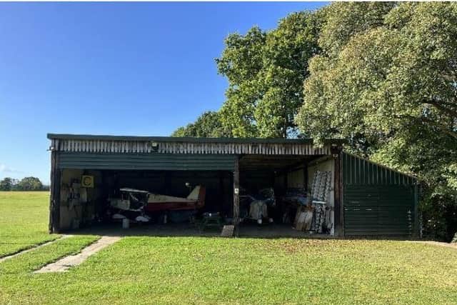 A landowner is seeking to obtain a 'Certificate of Lawful Development' from Horsham District Council for aircraft hangars at a private airfield at Adversane