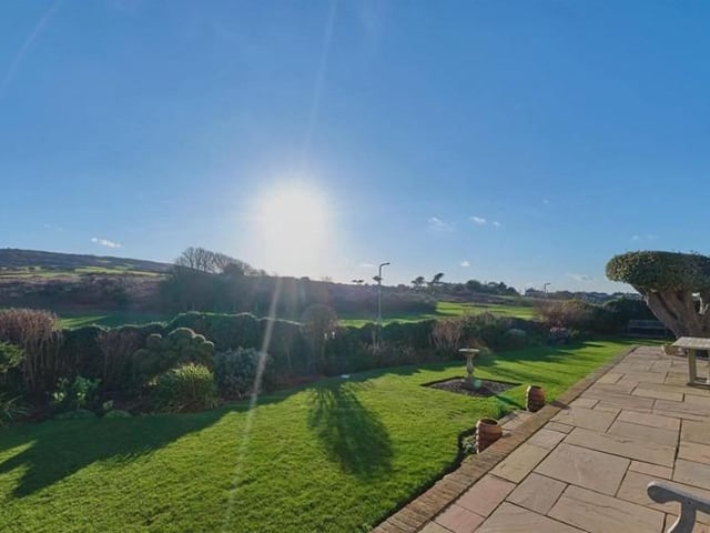 Surrounded by the South Downs National Park, with over two miles of un-commercialised promenade and beach.
Outside the attractively landscaped gardens with infinity style view wraps around the property to three elevations and has been lovingly tended by the current owner. There are several seating areas, established flower beds and borders alongside many mature trees.