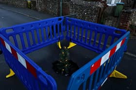 Soon after it appeared, cheeky residents decorated the sink hole with a Christmas tree.