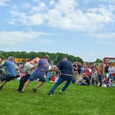 Fairground rides, stalls and arena displays, including a tug of war, were all visible during the event.