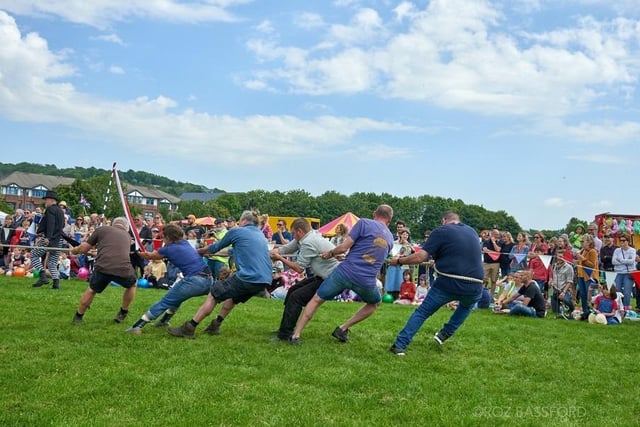 Fairground rides, stalls and arena displays, including a tug of war, were all visible during the event.